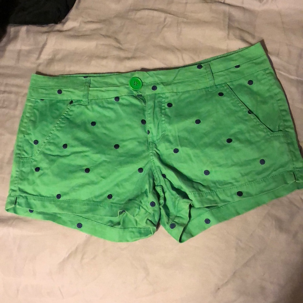 Green shorts with blue Polk a dots.